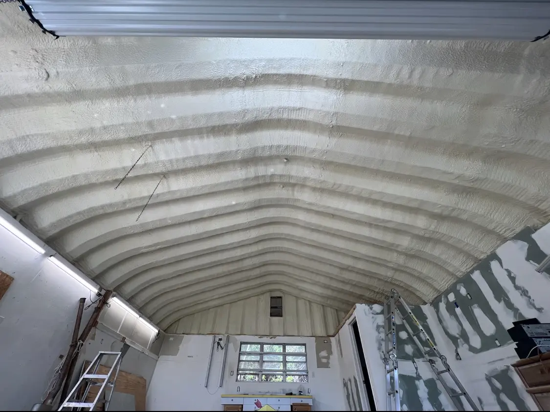 Spray polyurethane foam applied to the underside of a metal roof deck in East Earl